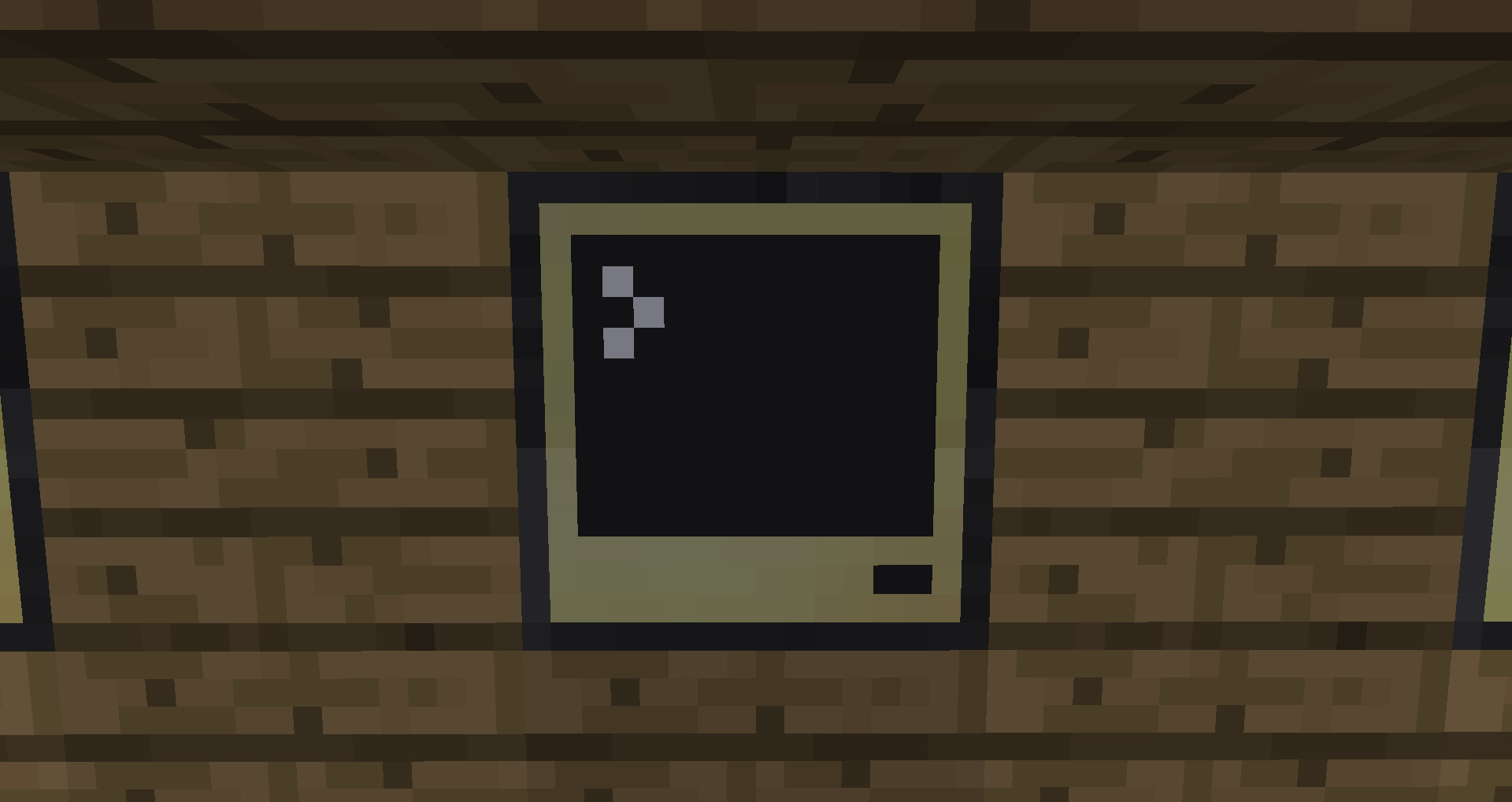 Blocky computer screen on 
    a wooden background